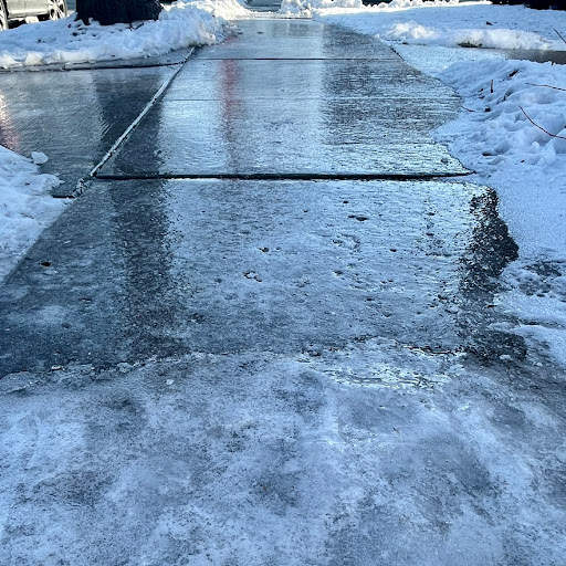 Cracked concrete driveway damage from freeze thaw cycle